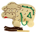 Dřevěné šitíčko na kolečkách - kravička / hračky pro nejmenší